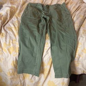 Green jeans with green buttons on back pocket